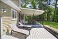 Sun deck between the screened in porch and patio/barbecue area