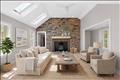 Inviting family room with cathedral ceiling, sky lights, propane stove and access to garage on the left and variable use office/game room to  the right. Virtually staged.