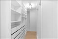 Walk-in closet 1st floor bedroom.