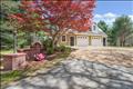 Large 2-car garage with mud room and lots of storage, parking for multiple vehicles.