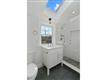 Luxurious full bathroom highlighted by Quartz and stone and glass finishings on second level in primary unit.