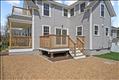 Primary residence - deck, parking, covered front porch and second floor balcony.