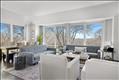 High ceilings and large windows fill the great room with natural light.
