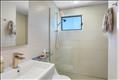 Both renovated bathrooms have tiled walk-in showers.