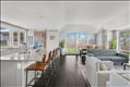 Generous open concept kitchen, living and dining space.