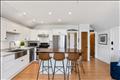 Kitchen with bedroom door, bathroom door and entrance door to right