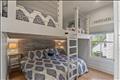 Bedroom with loft bunks over king bed