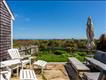 Private patio off of the primary bedroom with broad ocean views.
