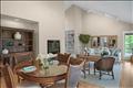 Open living/dining area with fireplace