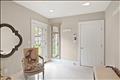 A bright and functional mudroom is conveniently located just off the attached one-car garage