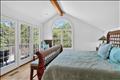 Sun-drenched primary suite with a dedicated office/sitting area