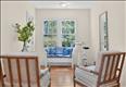 A bright, serene sitting area designed for quiet contemplation, reading, and reflection