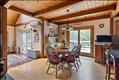 The dining room boasts a fabulous enamel pellet stove