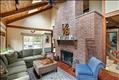 Floor-ceiling brick wood-burning fireplace
