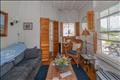 Cozy coastal den/tv room designed for relaxation and casual gatherings.