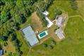 30 Elias Lane offers a main house, guest house, pool and private tennis courrt.