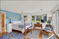 First floor primary with meadow views.